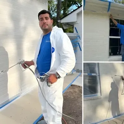 Exterior house painting with sprayer and masked windows — Grand Prairie, TX | Goldstar Renovations