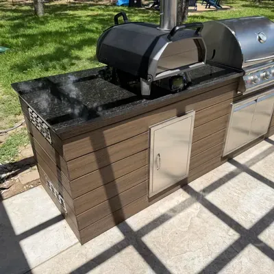 Outdoor kitchen with built-in grill and granite countertop — Rockwall, TX