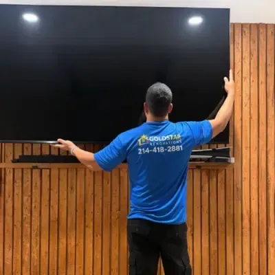Television mounted on custom cedar slat accent wall — Dallas, TX | Goldstar Renovations