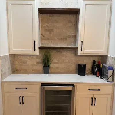 Custom wet bar cabinetry with stone backsplash — Prosper, TX